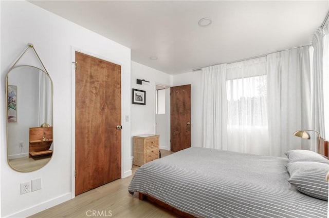 2650 Main St Unit 3, Cambria, CA 93428 - bedroom with baseboards and light wood-type flooring