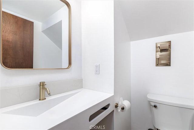 half bath with toilet and vanity