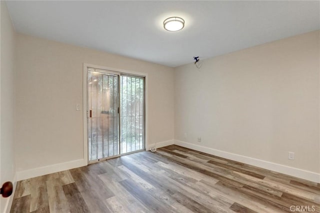 402 E Glendale Dr, Orange, CA 92865 - empty room featuring wood finished floors and baseboards