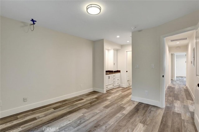 402 E Glendale Dr, Orange, CA 92865 - spare room featuring wood finished floors, baseboards, and recessed lighting