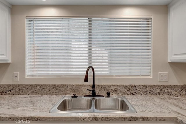 402 E Glendale Dr, Orange, CA 92865 - kitchen view of a sink, white cabinetry, and light countertops