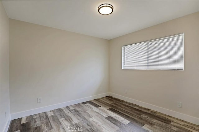 402 E Glendale Dr, Orange, CA 92865 - empty room featuring wood finished floors and baseboards