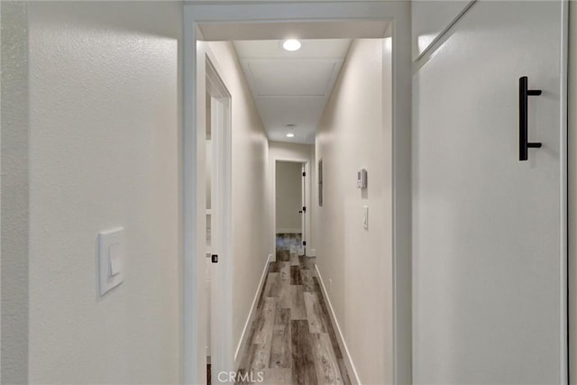 402 E Glendale Dr, Orange, CA 92865 - hallway with wood finished floors, baseboards, and attic access