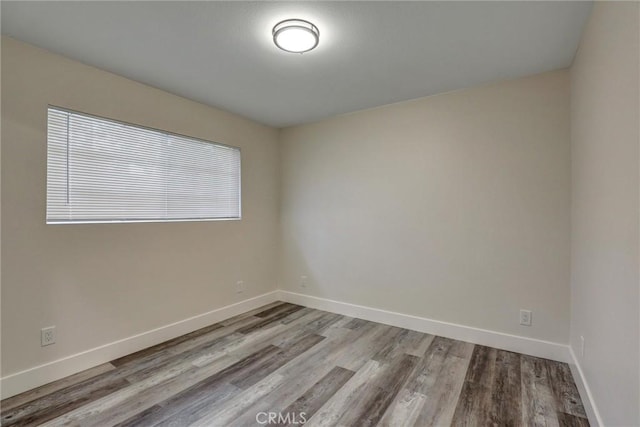402 E Glendale Dr, Orange, CA 92865 - spare room featuring wood finished floors and baseboards