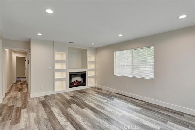 402 E Glendale Dr, Orange, CA 92865 - unfurnished living room featuring wood finished floors, baseboards, a fireplace, and recessed lighting