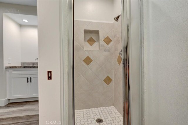 402 E Glendale Dr, Orange, CA 92865 - full bathroom with a shower stall, wood finished floors, and recessed lighting