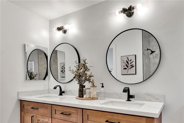 bathroom featuring a sink and double vanity