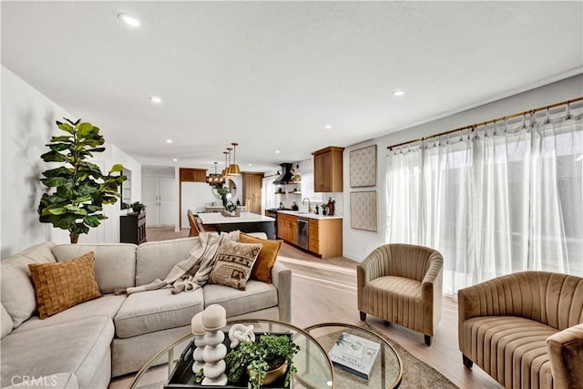 living room featuring light wood-style floors and recessed lighting