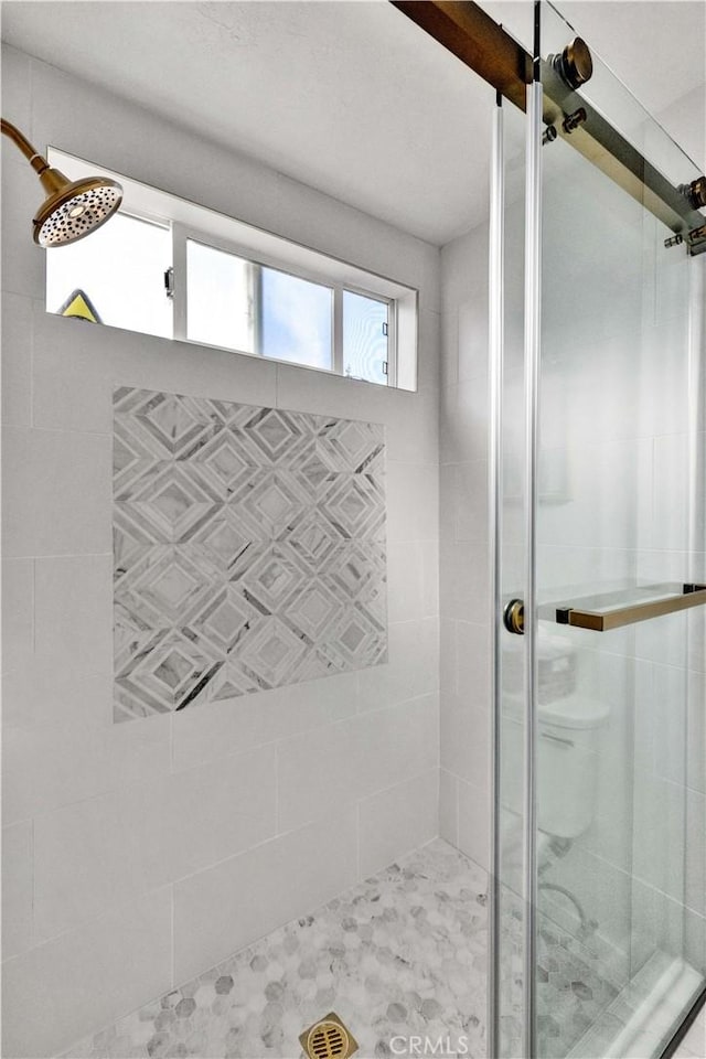 full bathroom featuring a shower stall