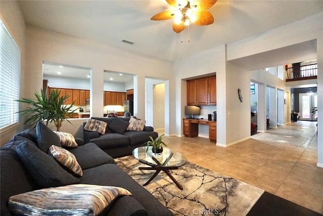 23801 Hollingsworth Dr, Murrieta, CA 92562 - living room with light tile patterned floors, visible vents, a ceiling fan, and a wealth of natural light