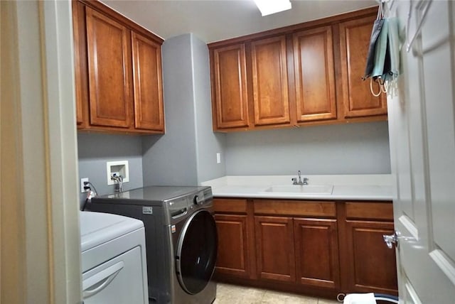 23801 Hollingsworth Dr, Murrieta, CA 92562 - laundry room featuring a sink, washing machine and dryer, and cabinet space