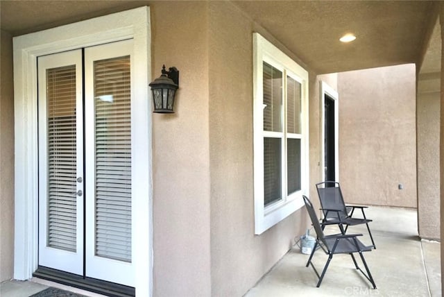 23801 Hollingsworth Dr, Murrieta, CA 92562 - view of exterior entry featuring french doors and stucco siding