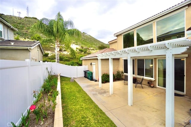 23801 Hollingsworth Dr, Murrieta, CA 92562 - view of yard featuring a pergola, a mountain view, a fenced backyard, and a patio area