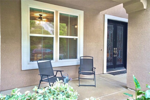 23801 Hollingsworth Dr, Murrieta, CA 92562 - view of exterior entry with french doors and stucco siding