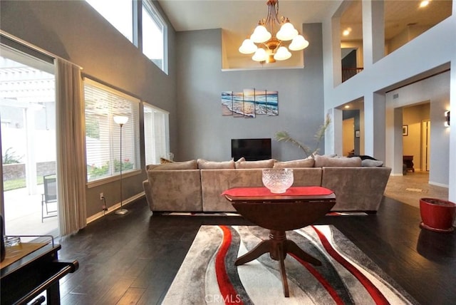 23801 Hollingsworth Dr, Murrieta, CA 92562 - interior space with baseboards, dark wood finished floors, a high ceiling, and a notable chandelier
