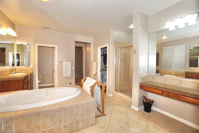 23801 Hollingsworth Dr, Murrieta, CA 92562 - bathroom featuring tile patterned flooring, vanity, toilet, a shower stall, and a garden tub