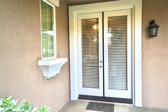 23801 Hollingsworth Dr, Murrieta, CA 92562 - view of exterior entry featuring stucco siding and french doors