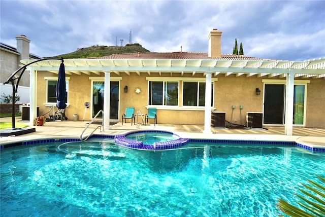 23801 Hollingsworth Dr, Murrieta, CA 92562 - back of property featuring a pergola, stucco siding, and a pool with connected hot tub
