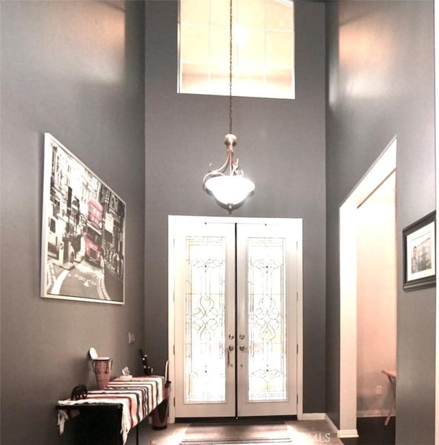 23801 Hollingsworth Dr, Murrieta, CA 92562 - entrance foyer with baseboards, french doors, and a towering ceiling