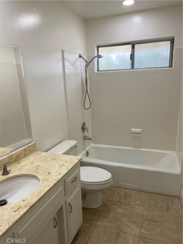 bathroom with bathing tub / shower combination, vanity, tile patterned flooring, and toilet