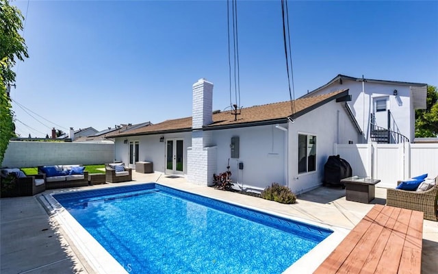 1055 N Mallard St, Orange, CA 92867 - rear view of property with outdoor lounge area, french doors, a chimney, and a fenced backyard