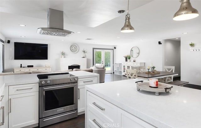 1055 N Mallard St, Orange, CA 92867 - kitchen with stainless steel range with electric stovetop, exhaust hood, open floor plan, white cabinetry, and recessed lighting