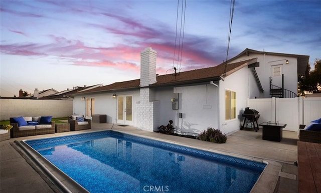 1055 N Mallard St, Orange, CA 92867 - rear view of house featuring a chimney, french doors, a patio area, and a fenced backyard