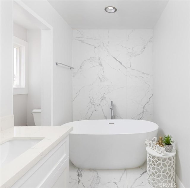 1055 N Mallard St, Orange, CA 92867 - full bath with marble finish flooring, a soaking tub, vanity, and recessed lighting