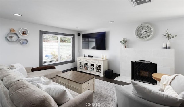 1055 N Mallard St, Orange, CA 92867 - living room with recessed lighting, wood finished floors, a tile fireplace, and baseboards
