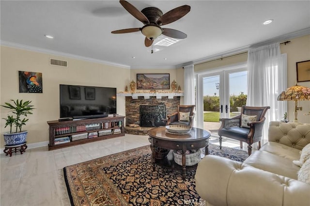 living area featuring a ceiling fan, french doors, a fireplace, ornamental molding, and visible vents