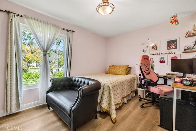 bedroom featuring light wood-type flooring