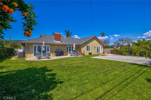 1506 Ameluxen Ave, Hacienda Heights, CA 91745 - rear view of property with stucco siding, cooling unit, a chimney, and a patio