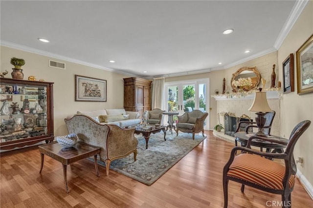 1506 Ameluxen Ave, Hacienda Heights, CA 91745 - living room featuring ornamental molding, wood finished floors, a brick fireplace, and recessed lighting
