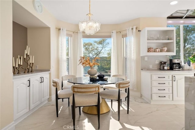 15 Pebble Bch, Coto De Caza, CA 92679 - dining space with light marble finish flooring, a chandelier, plenty of natural light, baseboards, and recessed lighting
