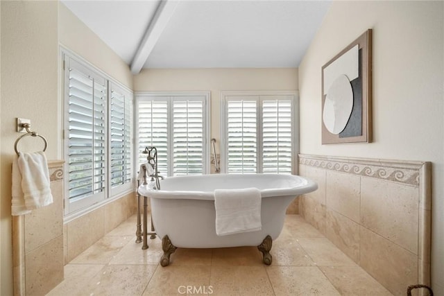 15 Pebble Bch, Coto De Caza, CA 92679 - bathroom with a soaking tub, healthy amount of natural light, wainscoting, and tile walls