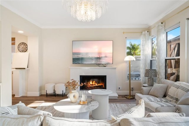 15 Pebble Bch, Coto De Caza, CA 92679 - living area with wood finished floors, a warm lit fireplace, a chandelier, baseboards, and crown molding