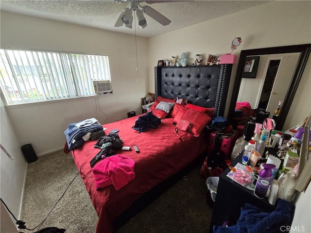 bedroom featuring ceiling fan, a textured ceiling, cooling unit, and carpet