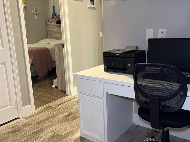 home office featuring light wood-style flooring