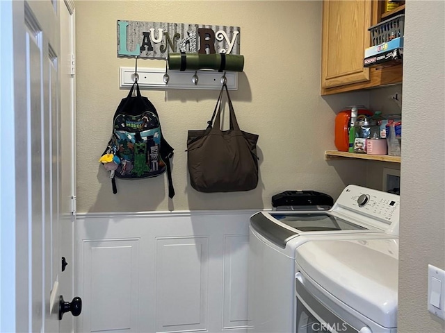 laundry area featuring cabinet space and washing machine and clothes dryer