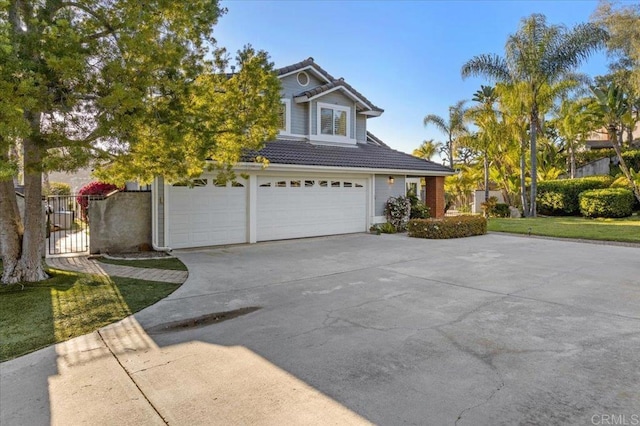 962 Chardonney Way, Escondido, CA 92029 - view of front of home with a tile roof, driveway, a garage, and a gate