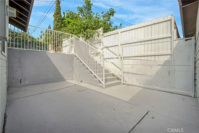 view of patio featuring stairway