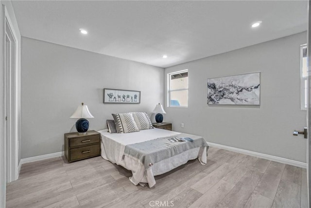 bedroom featuring recessed lighting, light wood-style flooring, and baseboards