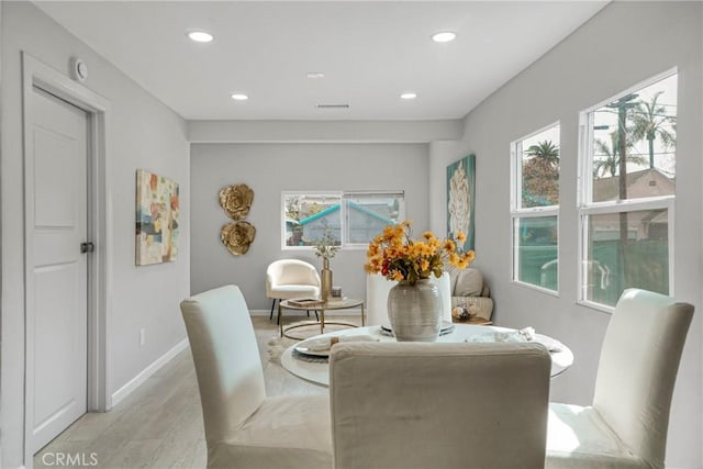 dining room featuring recessed lighting, baseboards, visible vents, and light wood-style flooring