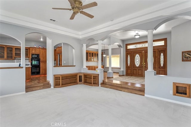 foyer featuring light carpet, a ceiling fan, visible vents, and baseboards