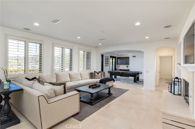 29311 Paseo Palmar, San Juan Capistrano, CA 92675 - living room with arched walkways, billiards, recessed lighting, and a high end fireplace