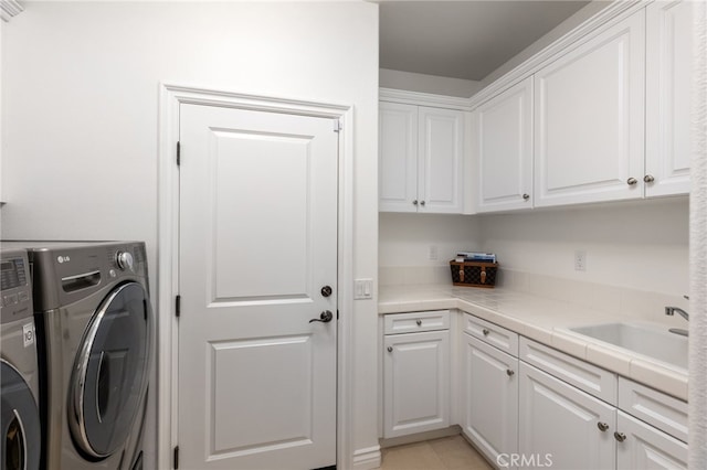 29311 Paseo Palmar, San Juan Capistrano, CA 92675 - laundry room featuring cabinet space, washing machine and clothes dryer, and a sink