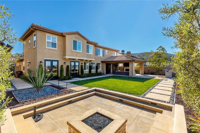29311 Paseo Palmar, San Juan Capistrano, CA 92675 - back of property with french doors, a gazebo, a fire pit, a patio area, and stucco siding