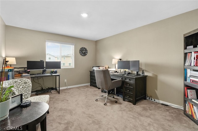 carpeted office with baseboards