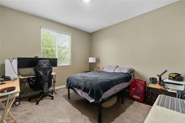 carpeted bedroom with baseboards