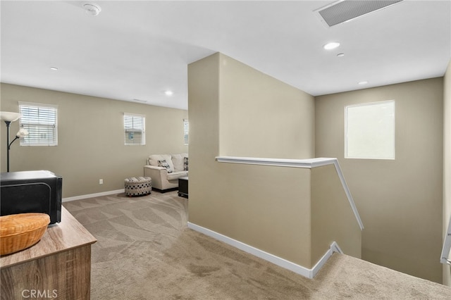 interior space with visible vents, baseboards, carpet floors, and recessed lighting
